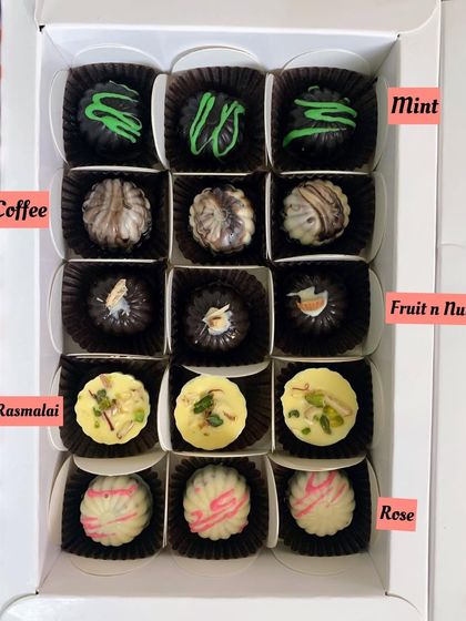 A peek inside my exotic chocolate box, featuring flavors like Mint, Coffee, Fruit & Nut, Rasmalai, and Rose. A perfect gift for any chocolate connoisseur.