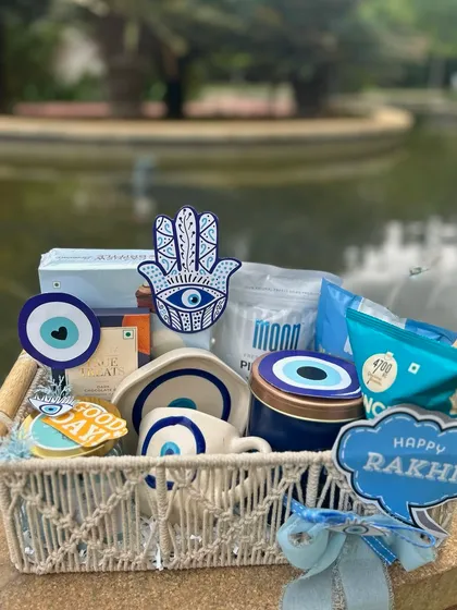 An "evil eye" themed Rakhi hamper for good luck and protection. Using a popular and symbolic theme can make your gifts more meaningful and marketable.