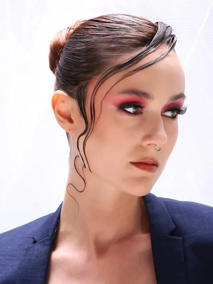 This is the kind of high-fashion editorial look I love to create. It's all about making a statement with bold color, sharp details, and a flawless skin finish that looks incredible on camera.