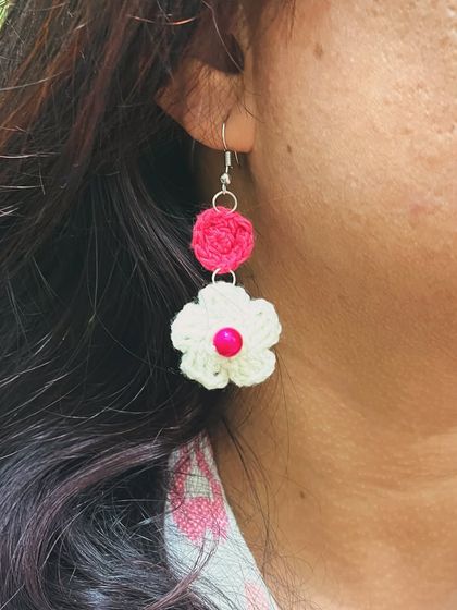 Here is a customer wearing my two-tiered floral earrings. The combination of pink and white with a pearl center is so pretty and delicate.