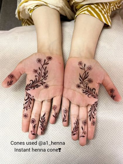 A delicate floral vine created with my instant henna cones, showing that even minimal designs can have a rich, beautiful color.