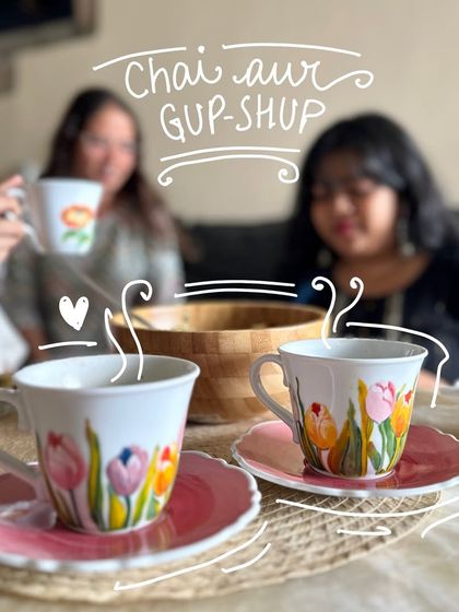 A cozy scene with our hand-painted tulip cup and saucer sets, perfect for 'chai aur gup-shup' with friends.