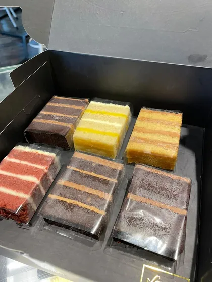 A look inside our Cake Slices Box. This selection includes a variety of our most loved flavours, from rich chocolate to classic red velvet.