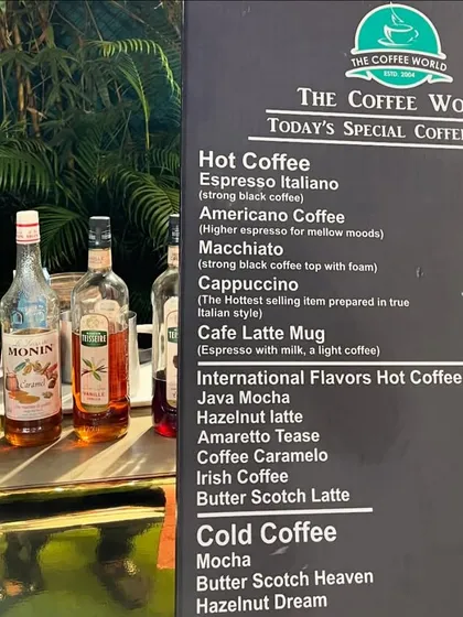 The extensive coffee and tea menu, featuring everything from classic Espresso Italiano to flavored lattes and cold coffees.