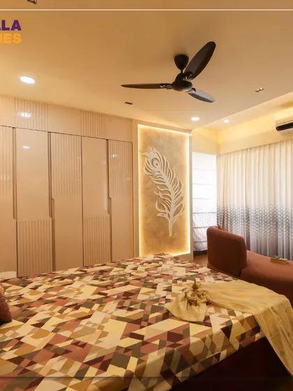 A view of the modern master bedroom highlighting the floor-to-ceiling wardrobe with grooved details and a beautiful backlit feather art piece that adds a soft, artistic touch.