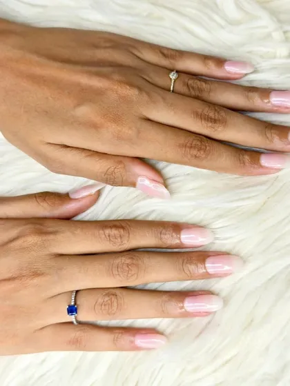 A clean and natural-looking set of Gel-X extensions with a semi-sheer pink polish, perfect for adding length while maintaining a subtle appearance.
