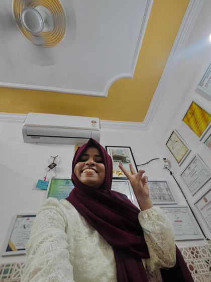 A victory pose in my studio. This space is my sanctuary, built from my passion for henna, and I'm proud to share it with you.