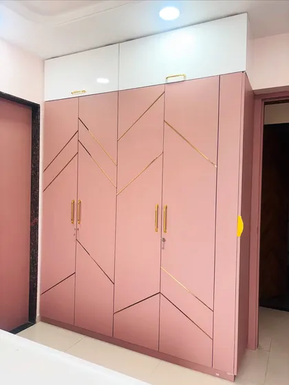 A slightly different angle of the pink wardrobe, showing its placement in the room.