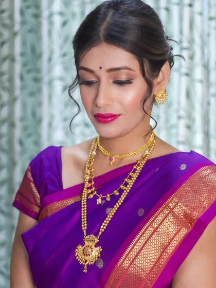 A beautiful portrait showcasing the dewy makeup I did to complement this purple Paithani saree. The look is all about glowing skin and elegant definition.