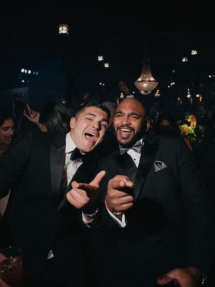 The groom and his friends enjoying the reception party, a perfect end to the three-day celebration.