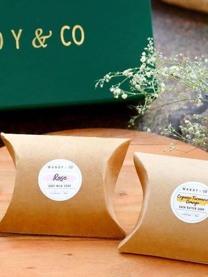 A close-up of the individually packaged Rose and Turmeric Orange soaps from my Radiant Diwali Treasures Gift Box.