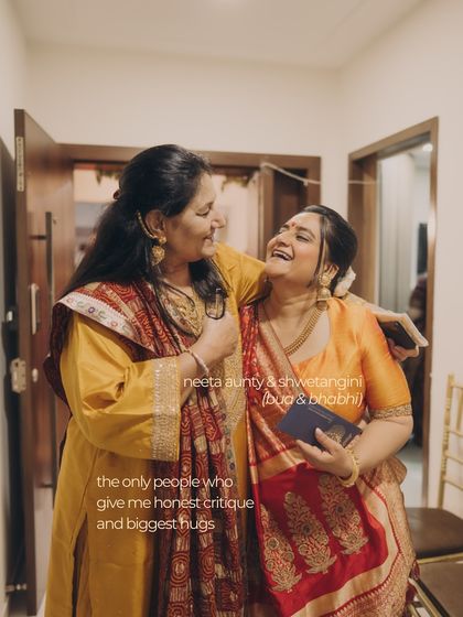 Two family members sharing a laugh. These honest critiques and big hugs from loved ones are what we cherish, and our styling aims to create an environment where these moments can flourish.