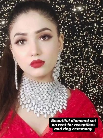 A model with bold red lips wearing a wide, sparkling American Diamond choker. The text overlay highlights that it's perfect for receptions and ring ceremonies.