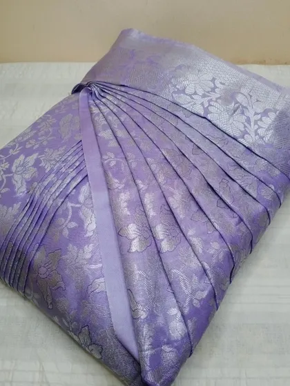 A beautiful lavender silk saree with silver brocade work.