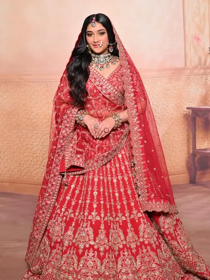 The results speak for themselves. Our students complete the course with a stunning portfolio, featuring looks like this classic red bridal.