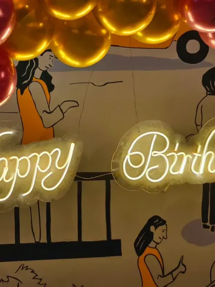 A close-up of the neon "Happy Birthday" sign used at a celebration at The Bier Library. This element adds a modern and celebratory glow to any event space.