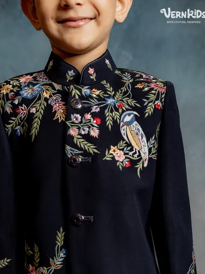 We believe luxury is in the details. This close-up highlights the delicate, handcrafted bird and floral embroidery that makes our Indo-western pieces true works of art, stitched with care and precision.