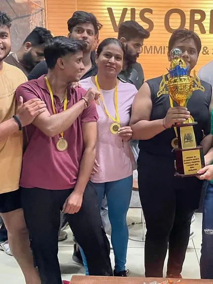 A close-up of our champions with the overall trophy. The joy and pride on their faces is what makes all the hard work worth it.