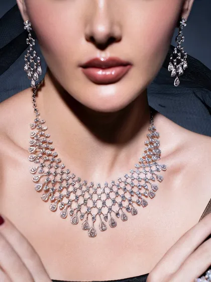 Diamonds are timeless, and styling them is about letting their brilliance shine. In this shoot for Myeves24, I focused on creating an elegant and classic look, using soft lighting and a simple backdrop to highlight the intricate design of the diamond necklace and earrings.