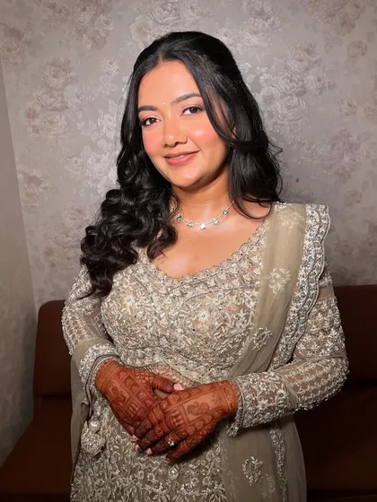 This bride's sangeet vision was all about glowing skin and clean eyes. We used shimmer liquid eyeshadows without kajal or liner for a luminous, radiant look that was uniquely her.