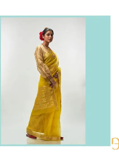 Another side view of the cadmium yellow saree, capturing its elegant and cheerful spirit.