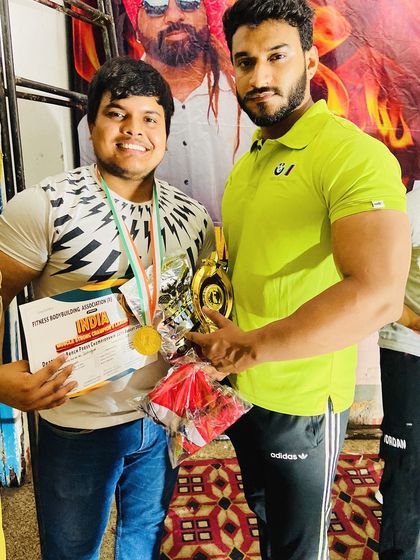 With my 'bade bhai' and student after his win. I stand by my team through every prep and every competition.