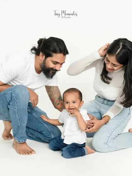 A candid moment of family interaction. The minimalist white background keeps the focus on the love and connection you share.