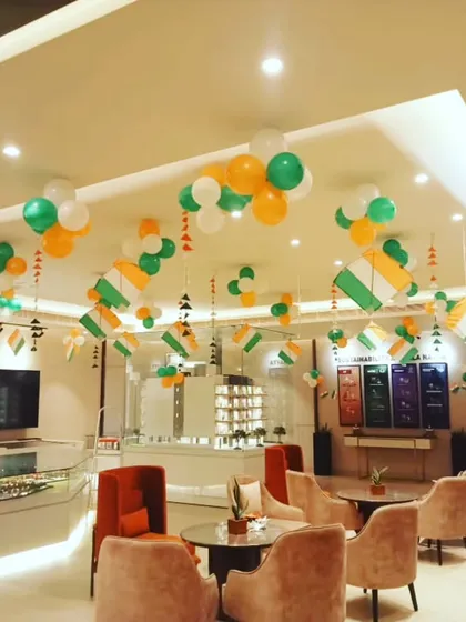 Another angle of the Independence Day office setup, showing how our ceiling decorations create a cohesive and celebratory atmosphere throughout the entire space, from the reception to the seating areas.