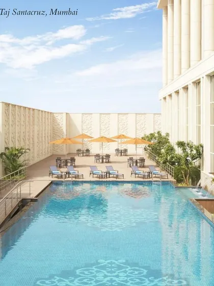 The sleek rooftop pool at Taj Santacruz, Mumbai. This venue is perfect for a chic, modern poolside Mehendi or cocktail party with city views.