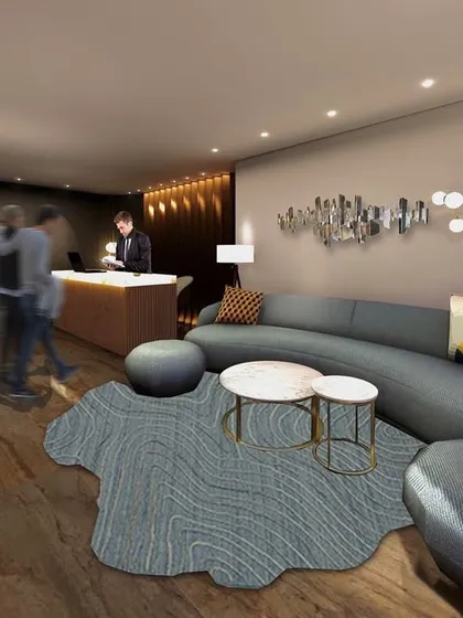 The reception area I designed for the Town Palace Inn. The goal was to create a welcoming first impression with a touch of modern luxury, using curved furniture, abstract art, and sophisticated lighting.