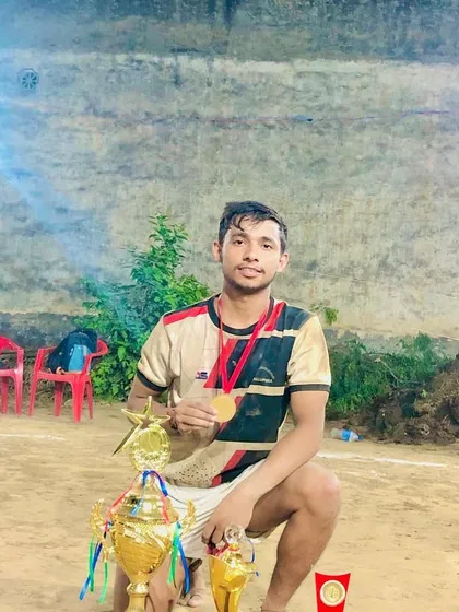 Posing with the collection of trophies won at the Ujada Modinagar tournament.