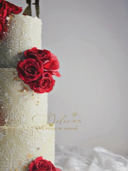 We're still looking for a name for this beauty. The contrast between the deep red roses and the detailed ivory stencil is just stunning.