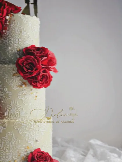 We're still looking for a name for this beauty. The contrast between the deep red roses and the detailed ivory stencil is just stunning.