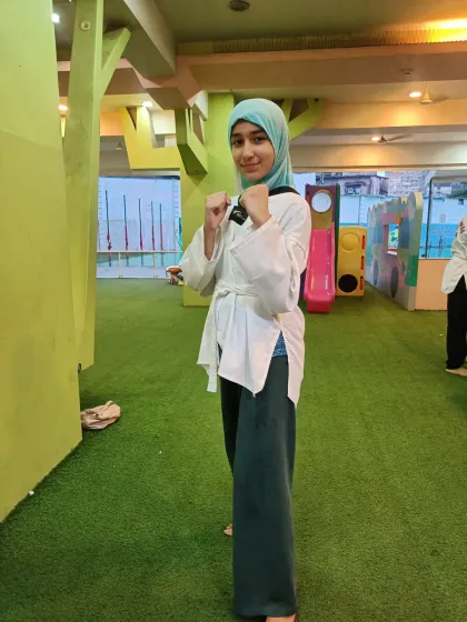A smile of confidence from one of our students. Taekwondo doesn't just build physical strength; it builds self-esteem.