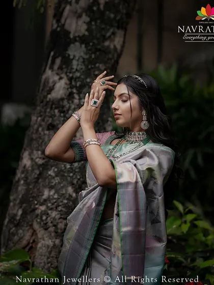 An artistic shot of the model, her pose reflecting the courage and grace of the goddess within.