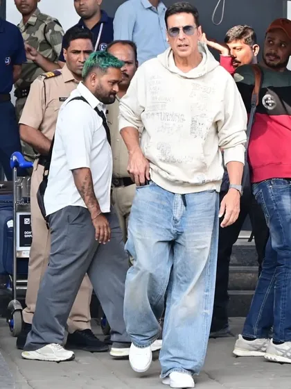 Airport style with an edge. We styled Akshay Kumar in oversized Balenciaga denims and a Mihara Yasuhiro sweatshirt for a look that is all about comfort and high-fashion grunge.