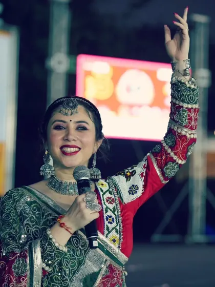 A candid shot of me smiling and interacting with the audience from the stage.