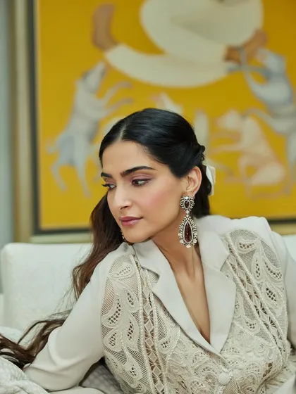 A detailed portrait of Sonam Kapoor, highlighting the intricate Amrapali jewels paired with her lace ensemble.
