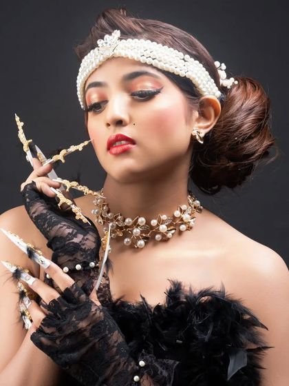 The complete look, where the fantasy nails become a central part of the model's artistic and glamorous character.