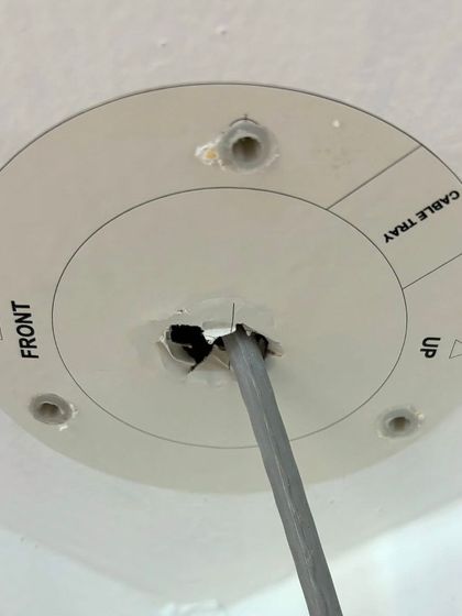 This is a mounting template sticker I use on false ceilings. It allows me to drill precise holes for the camera base, ensuring a perfect and secure fit every time.