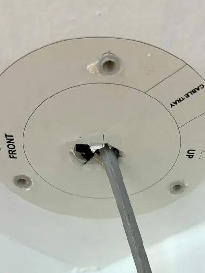 This is a mounting template sticker I use on false ceilings. It allows me to drill precise holes for the camera base, ensuring a perfect and secure fit every time.