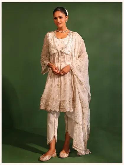This all-time favorite festive pick is now on sale. The off-white anarkali with delicate embroidery is a graceful and elegant choice for any celebration. Grab it before it's gone.