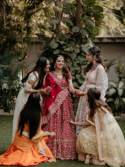 A heartwarming photo of the bride with her bridesmaids. It shows how my makeup stands out beautifully in group photos.