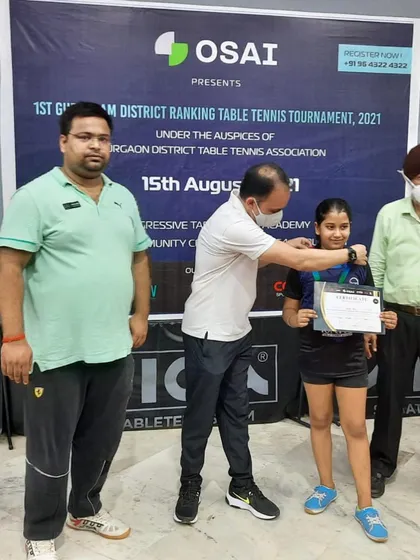Varya receiving her gold medal at the Gurgaon District Ranking Tournament. It's amazing to see such incredible results with just six months of dedicated table tennis training.
