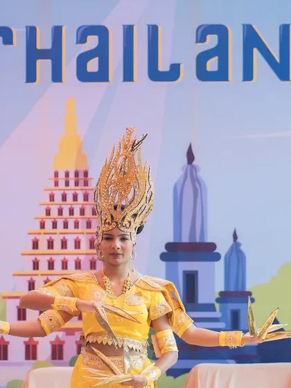 Transporting guests to Thailand with this 'World Tour' themed performance. The dancer's intricate costume, golden headdress, and traditional hand movements captured the beauty of Thai culture.