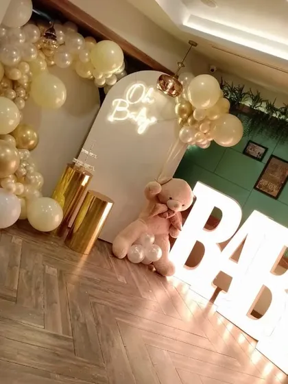 For this baby shower, we added large, light-up 'BABY' marquee letters to the 'Oh Baby' theme. This image shows how the letters add another layer of decoration and create a fantastic photo opportunity for the parents-to-be.