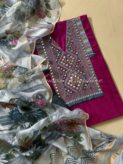 A top-down view of the ensemble, showing the harmonious blend of the vibrant kurta and the softly colored floral dupatta.