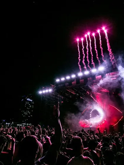 Pyrotechnics light up the night sky at a massive concert in Dubai. This shot is all about capturing the spectacle and the grand scale of modern music festivals.