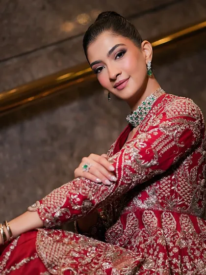 This angle highlights the beautiful structure of the outfit and the clean, glowing makeup. It’s a perfect example of modern Indian bridal style, blending tradition with contemporary design.