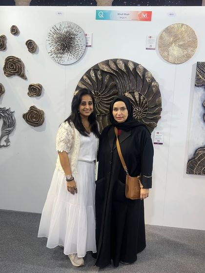 With another guest at the Qatar art show. It was wonderful to share my upcycled, textured art with a new audience.